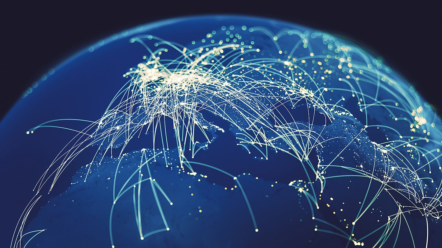 Picture of the globe with glowing arcs connecting cities