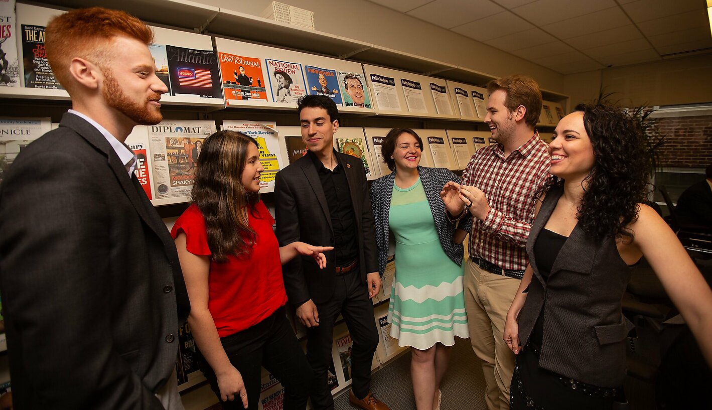 Four interns standing and socializing