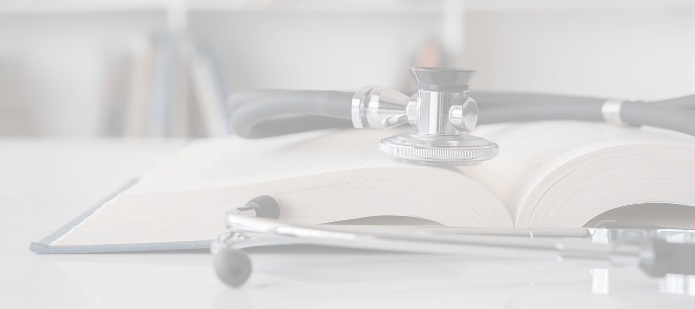 Stethoscope on stack of books.