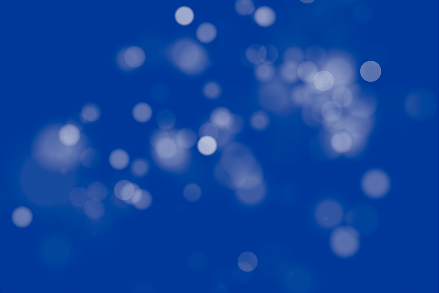 Light blue bokeh lights against a Cato Blue background.