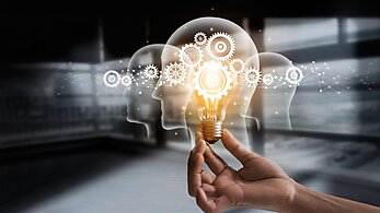 Lightbulb Being Held to Symbolize Ideas and Innovation