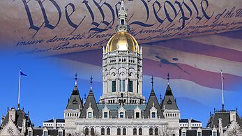 State capitol building with a flag and the constitution in the background