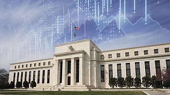 Federal reserve building with graph lines above it