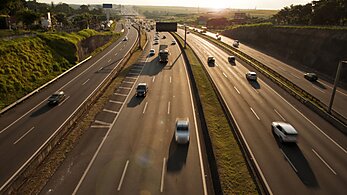 Aerial view of highway with cars and trucks on it