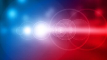 A blurred view of red and blue police car lights