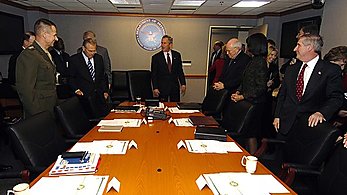 President George W. Bush and his national security team gather in the Pentagon's Executive Support Center for briefings on the latest developments in Iraq, Afghanistan and the global war on terror on Jan. 4, 2006.