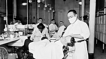 black and white image of a barbershop in 1918