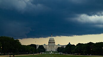 View of the capitol with storms on the horizon
