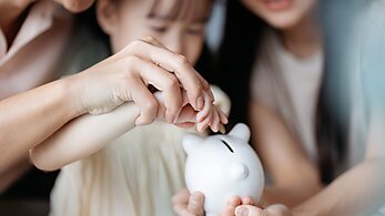 Family with Piggy Bank