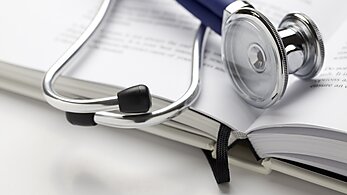 Stethoscope on book