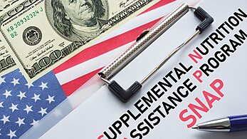 Supplemental Nutrition Assistance Program Clipboard and US Dollar