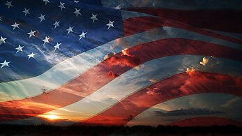 American flag over sunset