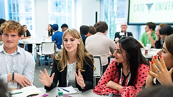 Students at a Cato University event.