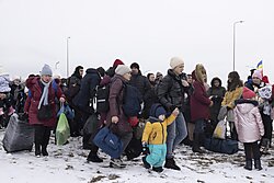 Refugees fleeing conflict make their way to the Polish border in March 2022 in Krakovets, Ukraine. 