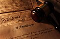 The constitution with the first amendment and a gavel