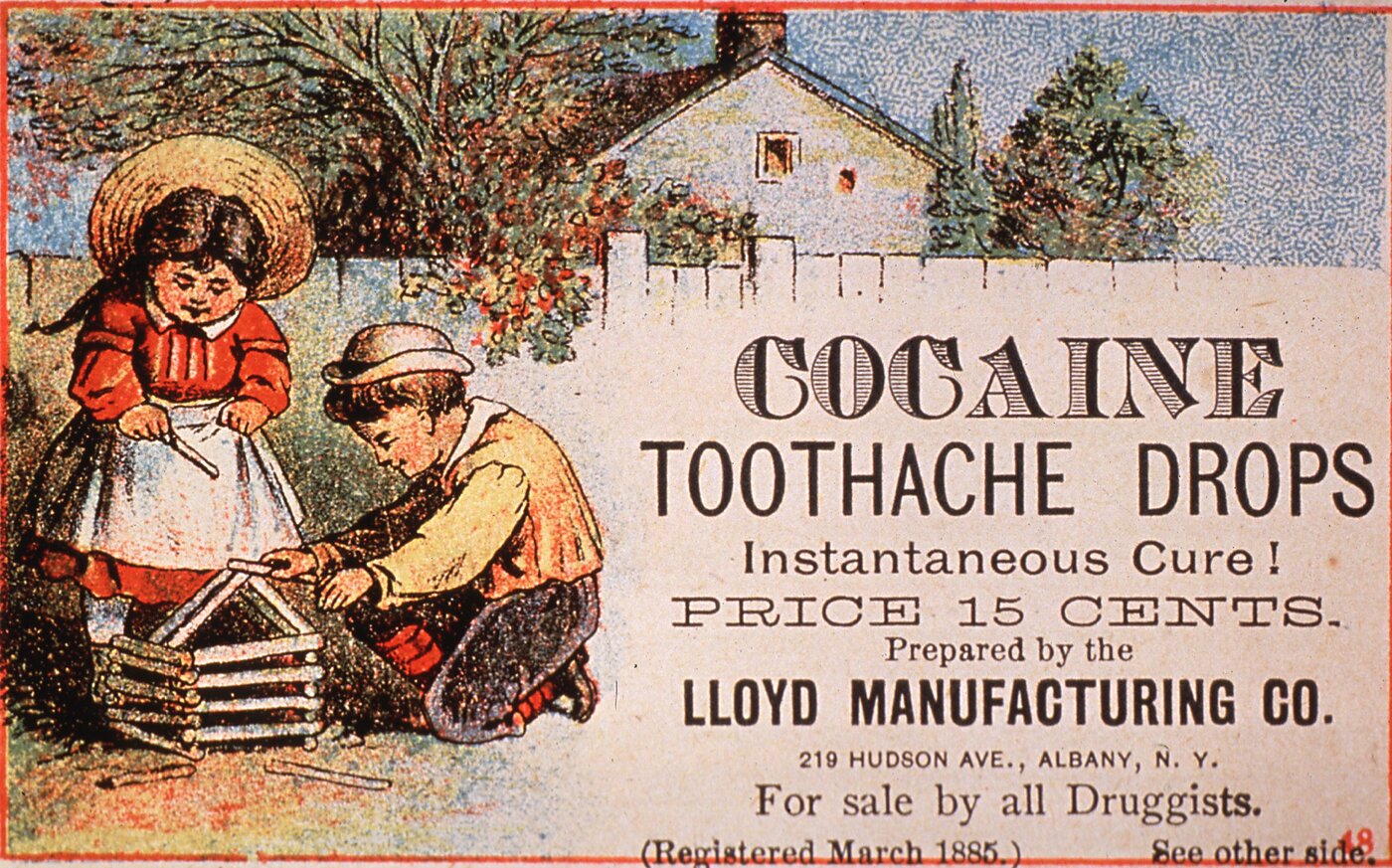 Advertisement for Cocaine Toothache Drops, claiming an "instantaneous cure," featuring two children playing outside.