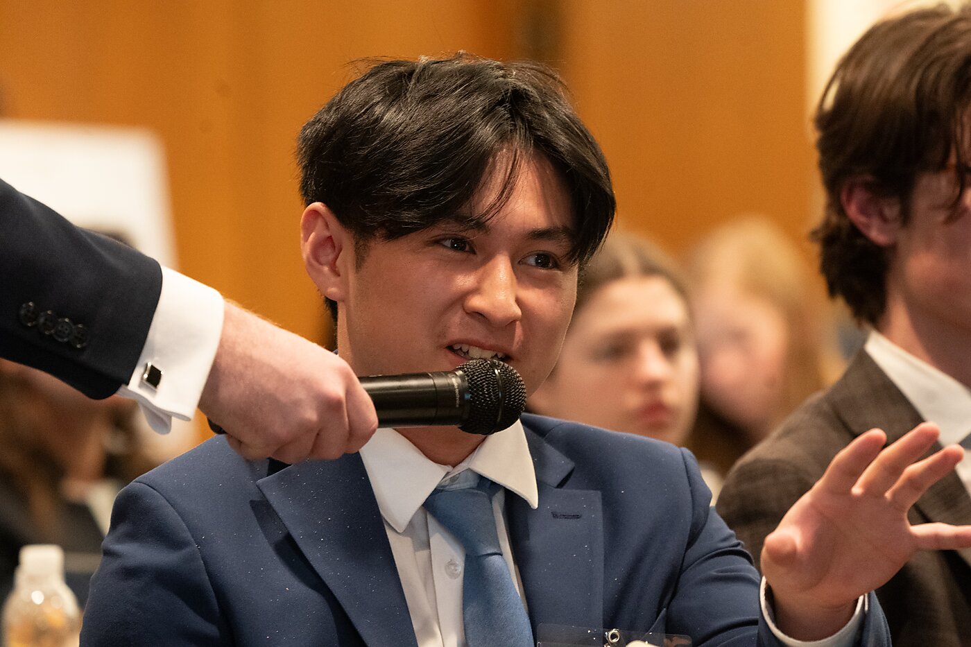 A student with a microphone