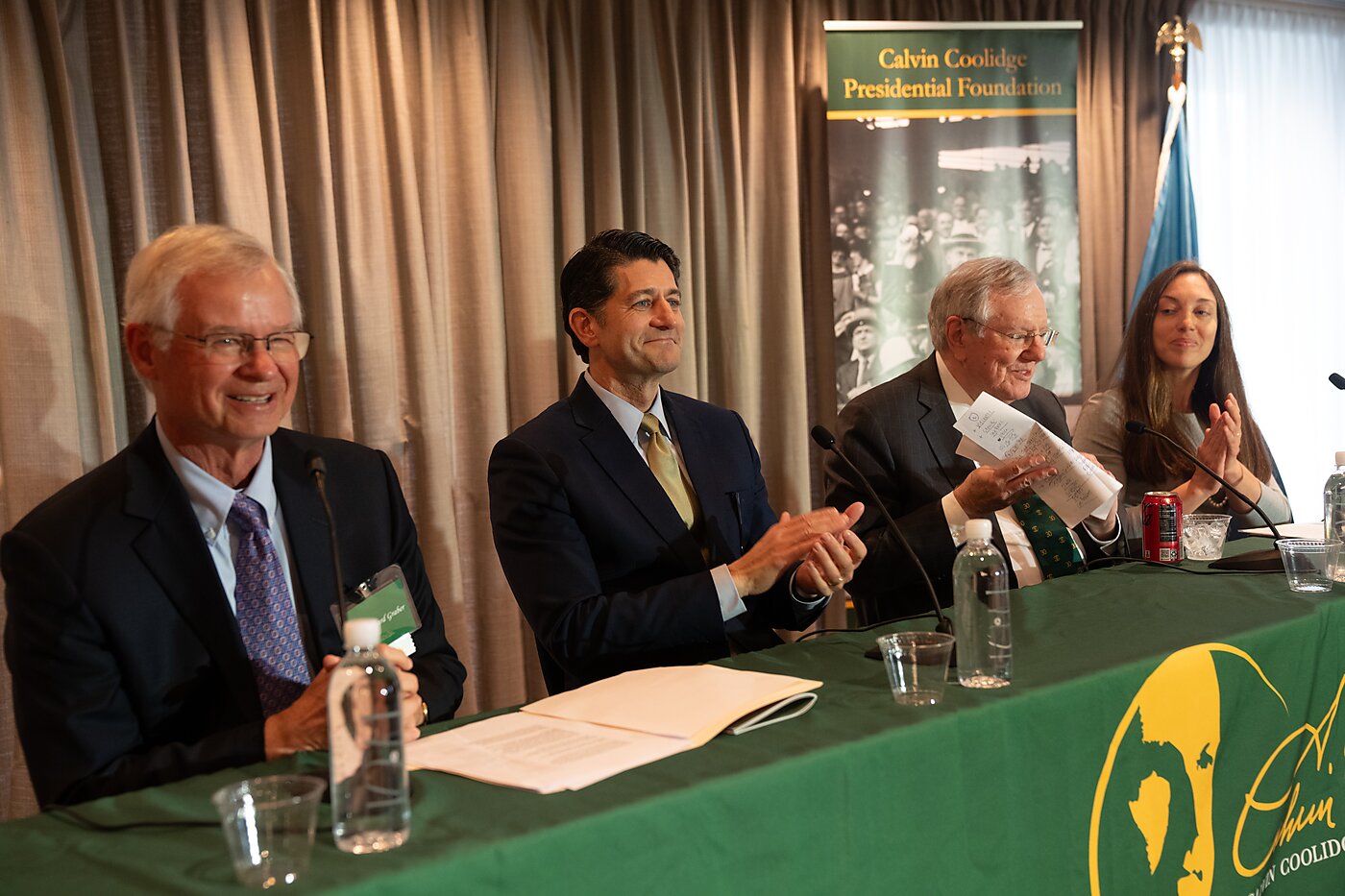 Four people at a conference