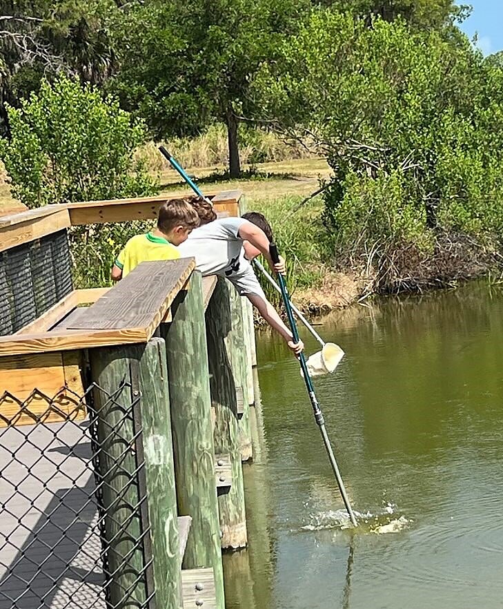 Curious and Kind kids exploring local marsh.